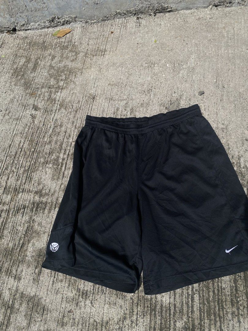 Nike black athletic shorts with white logo (Category: Shorts) located in Manila. Submitted by mystic.enrique_romulo (Listing ID 1471316469, Image 2). Description: - Brand: Nike - Color: Classic Black - Material: Lightweight, breathable mesh fabric - Fit: Comfortable elastic waistband - Design: Features small white Nike swoosh near bottom hem - Versatility: Ideal for workouts, lounging, or daily casual wear - Condition: Excellent / Ready to wear.