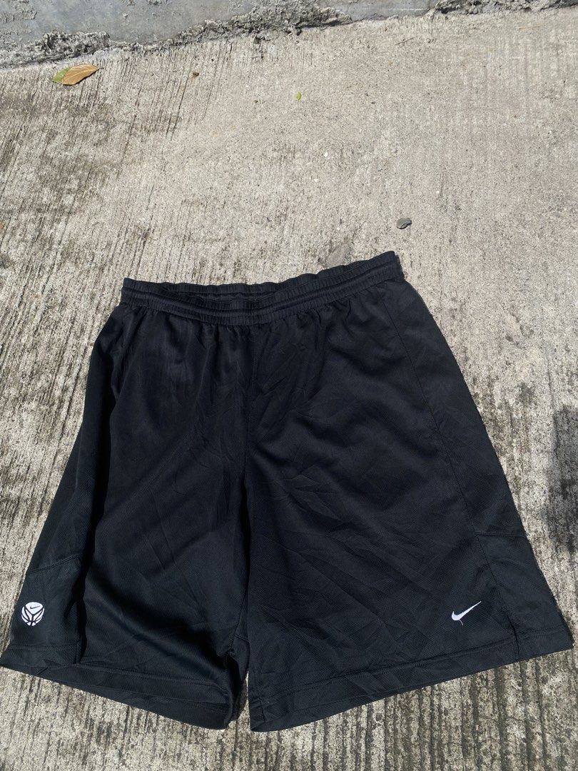 Nike black athletic shorts with white logo (Category: Shorts) located in Manila. Submitted by mystic.enrique_romulo (Listing ID 1471316469, Image 1). Description: - Brand: Nike - Color: Classic Black - Material: Lightweight, breathable mesh fabric - Fit: Comfortable elastic waistband - Design: Features small white Nike swoosh near bottom hem - Versatility: Ideal for workouts, lounging, or daily casual wear - Condition: Excellent / Ready to wear.