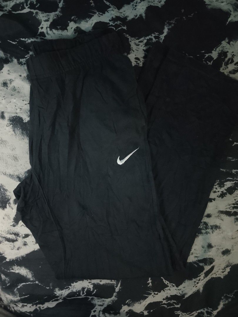 Nike Black Sweatpants Track Pants (Category: Joggers) located in Las Pinas. Submitted by solisjethr46316 (Listing ID 1471302765, Image 1). Description: - Brand: Nike - Color: Black with white swoosh logo on the left leg - Fit: Straight leg style with a comfortable elastic waistband - Material: Soft, lightweight, and breathable fabric - Versatility: Perfect for workouts, gym sessions, or casual lounging - Condition: Brand new / Excellent quality -