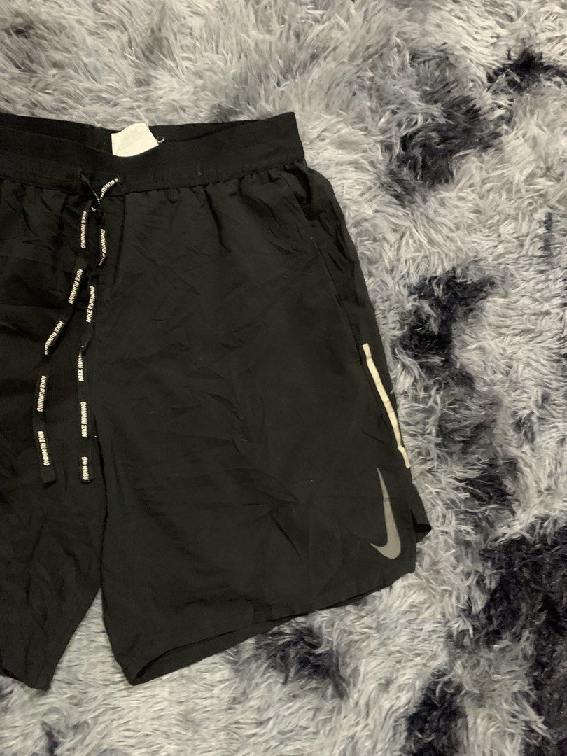 Nike Dri-FIT Running Shorts Black (Category: Activewear) located in Iba. Submitted by thriftcoyan (Listing ID 1471330416, Image 3). Description: - Brand: Nike Running shorts -Size Small -29-32 - Color: Black - Condition: Brand new with tags attached - Dri-FIT technology keeps you dry and comfortable - Lightweight material with side panels for enhanced movement - Branded drawstring waist for a secure fit - Reflective Nike swoosh for low-light visi