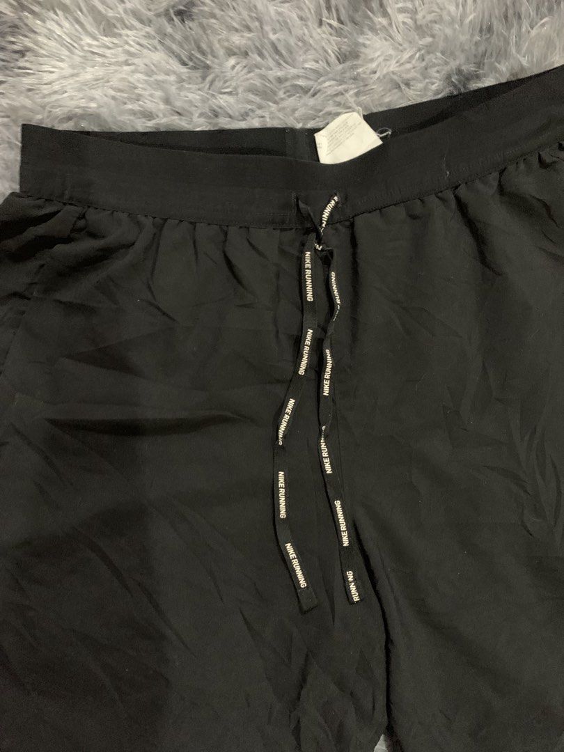 Nike Dri-FIT Running Shorts Black (Category: Activewear) located in Iba. Submitted by thriftcoyan (Listing ID 1471330416, Image 2). Description: - Brand: Nike Running shorts -Size Small -29-32 - Color: Black - Condition: Brand new with tags attached - Dri-FIT technology keeps you dry and comfortable - Lightweight material with side panels for enhanced movement - Branded drawstring waist for a secure fit - Reflective Nike swoosh for low-light visi