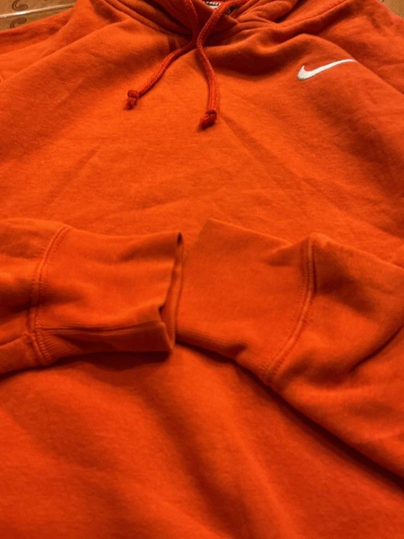 Nike Orange Hoodie Pullover Sweatshirt Size M (Category: Coats, Jackets and Outerwear) located in Manila. Submitted by cualesdyla42584 (Listing ID 1471398999, Image 3). Description: - Brand: Nike - Color: Bright Orange with embroidered white swoosh - Size: Medium (Style code: BV4119-891) - Material: Soft fleece interior, warm and cozy - Features: Classic drawstring hood, front pouch pocket, ribbed cuffs and hem - Condition: Excellent, shapes hold