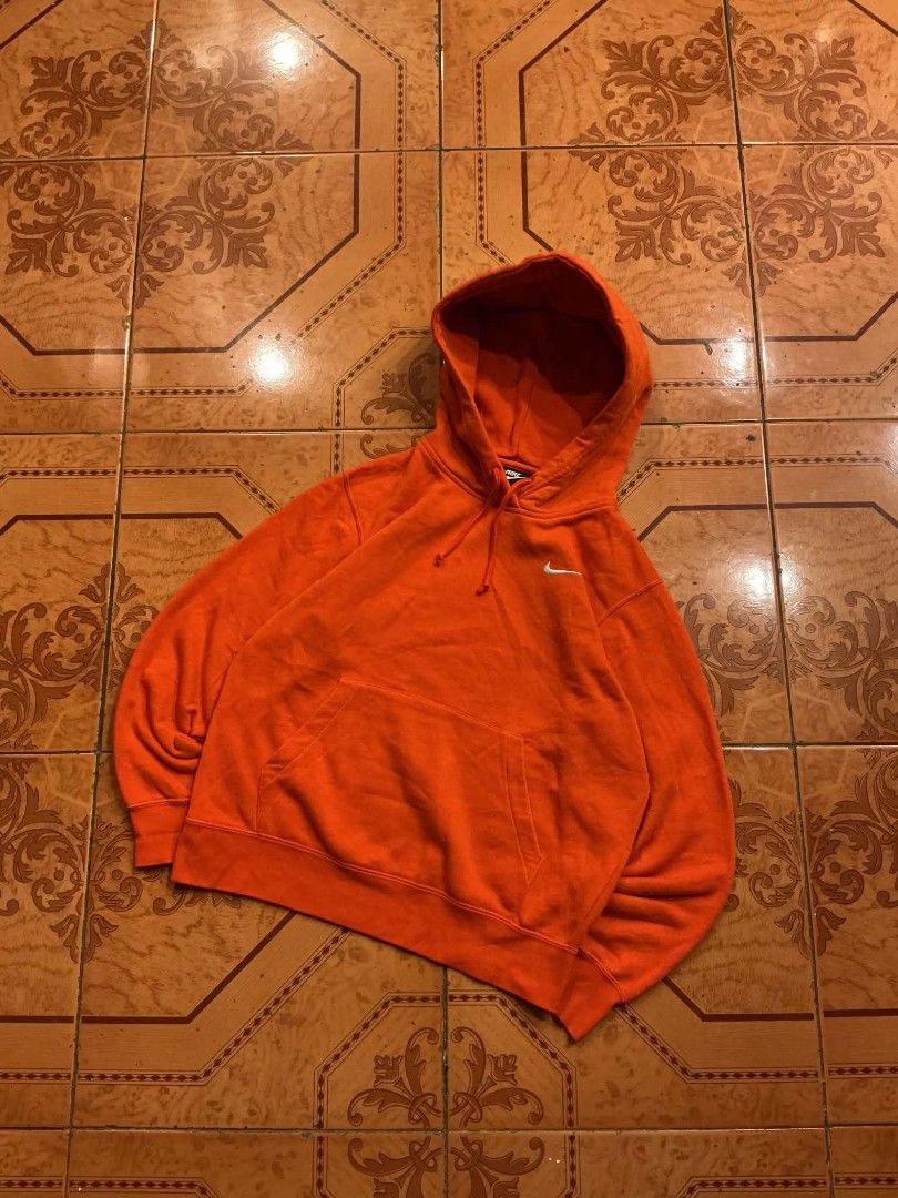 Nike Orange Hoodie Pullover Sweatshirt Size M (Category: Coats, Jackets and Outerwear) located in Manila. Submitted by cualesdyla42584 (Listing ID 1471398999, Image 1). Description: - Brand: Nike - Color: Bright Orange with embroidered white swoosh - Size: Medium (Style code: BV4119-891) - Material: Soft fleece interior, warm and cozy - Features: Classic drawstring hood, front pouch pocket, ribbed cuffs and hem - Condition: Excellent, shapes hold