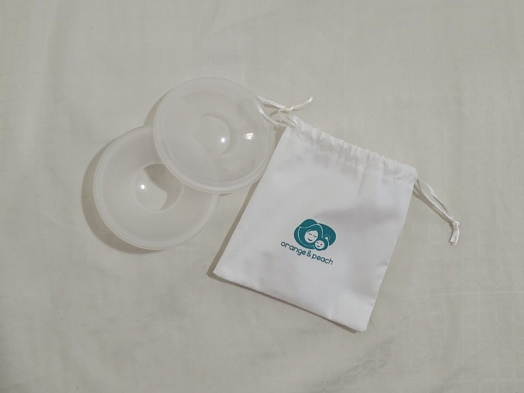 Orange & Peach Milk Saver Breast Shells with Storage Bag (Category: Breastfeeding & Bottle Feeding) located in Paranaque City. Submitted by penguinkiwi (Listing ID 1471371333, Image 1). Description: - Brand: Orange and Peach - With original pouch, no box - Used only a few times - Purpose: Catches letdown milk while nursing or pumping.