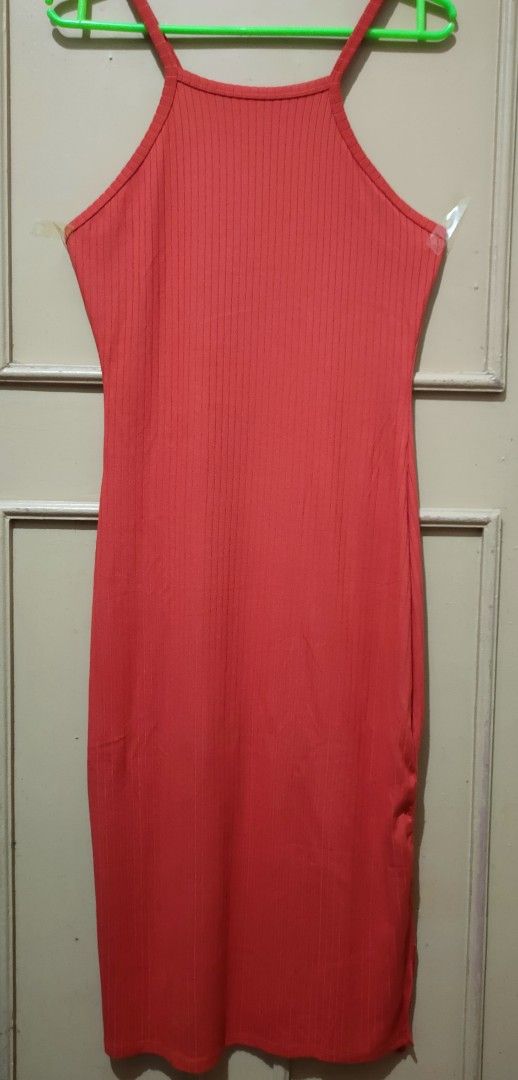 Orange ribbed spaghetti strap bodycon midi dress (Category: Dresses) located in Manila. Submitted by hazelgrcx (Listing ID 1471410045, Image 1). Description: - Color: Orange - Material: All-over ribbed, stretchy fabric - Fit: Bodycon, hugs the body well - Length: Midi length - Design: Spaghetti straps with a high neckline - Style: Simple and versatile for any occasion.