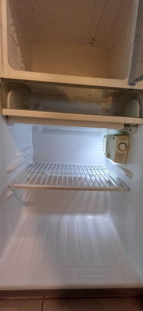 Panasonic NR-A5613ES Fridge (Category: Refrigerators and Freezers) located in Quezon City. Submitted by joemendoza00 (Listing ID 1471301310, Image 3). Description: - Brand/Model: Panasonic NR-A5613ES single door refrigerator - Color/Design: Silver exterior with a sleek vertical handle and standard compact size - Features: Includes wire shelving, temperature control dial, and a freezer compartment - Condition: 100% working condition, selling to cl