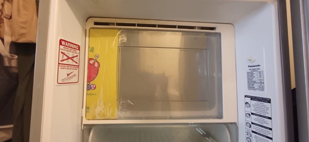 Panasonic NR-A5613ES Fridge (Category: Refrigerators and Freezers) located in Quezon City. Submitted by joemendoza00 (Listing ID 1471301310, Image 2). Description: - Brand/Model: Panasonic NR-A5613ES single door refrigerator - Color/Design: Silver exterior with a sleek vertical handle and standard compact size - Features: Includes wire shelving, temperature control dial, and a freezer compartment - Condition: 100% working condition, selling to cl