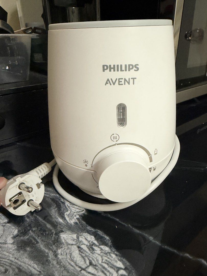 Philips Avent Fast Baby Bottle Warmer SCF355 (Category: Breastfeeding & Bottle Feeding) located in Pasig City. Submitted by athriftrack (Listing ID 1471314722, Image 2). Description: - Condition: Powers up, red indicator light working, clean inside heating basket - Features: Adjustable dial for defrosting and warming milk or baby food - Inclusions: Comes with original manual and box.