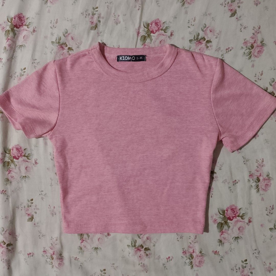 Pink top bundle short sleeve and long sleeve collared top (Category: Blouses) located in Tuguegarao City. Submitted by precious_gemss (Listing ID 1471305747, Image 3). Description: Two pink tops included in this set. One is a short sleeve ribbed crop top with a Kiomo brand tag showing size S-M. The other is a long sleeve collared button-down ribbed top with size M tag. Soft ribbed knit material in light pink shades. Great basic pieces for casual 