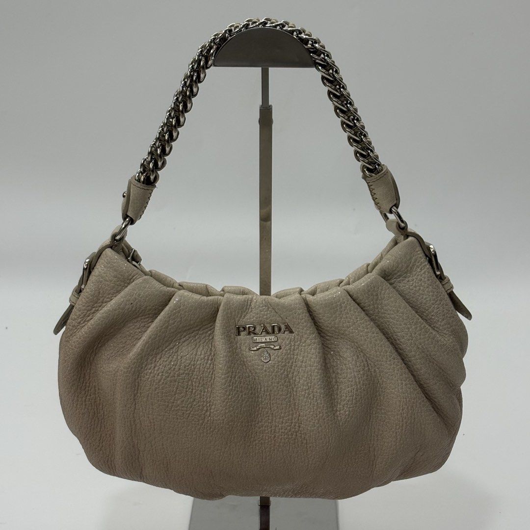 Prada Beige Cervo Chain strap Bag (Category: Luxury Bags & Wallets) located in Angeles City. Submitted by therandomstuff011 (Listing ID 1471412803, Image 1). Description: This is the Prada Beige Cervo Lux Leather Chain Strap Bag (Model BR3828), crafted from soft pebbled deer leather with a gathered/pleated body and a silver-tone chain-link shoulder strap.