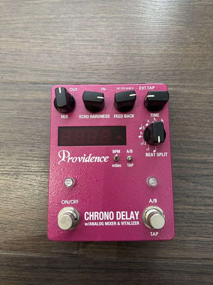 Providence Chrono Delay DLY-4 Guitar Effects Pedal (Category: Musical Instruments) located in Makati City. Submitted by heartbreakwarfare55 (Listing ID 1471364579, Image 1). Description: - Model: Providence Chrono Delay DLY-4 (Made in Japan) - Color: Vibrant pink with digital display screen - Features: Built-in analog mixer, Vitalizer circuit, and tap tempo - Controls: Beat split, mix, echo hardness, feedback, and time - I/O: Standard power input