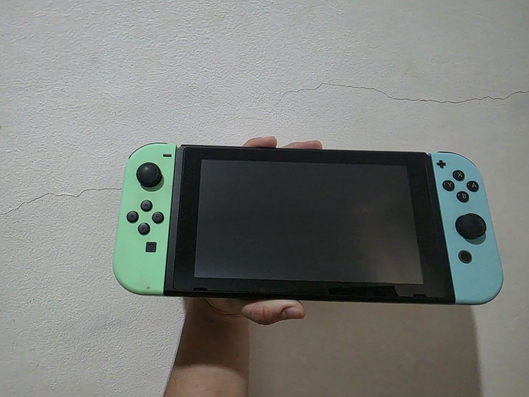 Second-hand Nintendo Switch ACNH Edition + ACNH Game (Category: Nintendo) located in Cebu City. Submitted by icyyysumm73630 (Listing ID 1471098253, Image 2). Description: Inclusions: - Nintendo Switch V2 ACNH Edition console - Original pastel Joy-Cons and Tom Nook-themed Dock - Original box and accessories - Separate portable carrying bag - Animal Crossing: New Horizons physical cartridge - Original game cartridge case Condition: Good with no kno