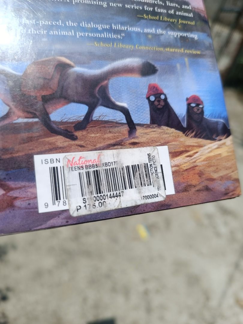The Wild Ones book novel (Category: Storybooks) located in Tumauini. Submitted by qeynichi (Listing ID 1471425834, Image 3). Description: - Title: The Wild Ones by K.C. Held - Genre: Animal adventure story starring Kit the raccoon and friends - Format: Paperback featuring a map illustration on the front inner pages - Price Tag: National Bookstore tag of 175 pesos still attached on the back cover - Condition: Pages show natural yellowing from age,