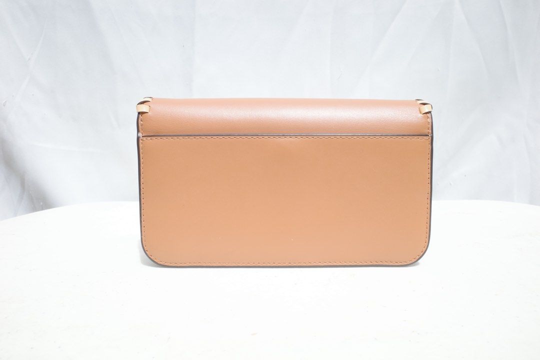 Tory Burch Britten Mixed Material Convertible Crossbody Bag (Category: Luxury Bags & Wallets) located in Antipolo. Submitted by bluelocker (Listing ID 1471330607, Image 3). Description: Decluttering! This is from my aunt’s personal collection. Used once, well kept in storage to preserve bag’s condition, no flaws, shipping care of buyer..