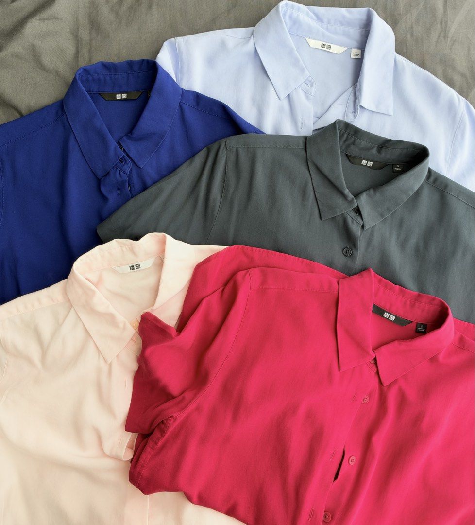 Uniqlo Rayon Blouse Short Sleeve (Category: Blouses) located in Taguig. Submitted by peanutbutterlove (Listing ID 1471360228, Image 1). Description: - Brand: Uniqlo - Size: Small (S) - Colors: Royal blue, light blue, dark grey, light pink, magenta pink - Design: Classic button-down collar with short sleeves - Fabric: Smooth, lightweight, and drapes nicely - Condition: Clean and well-kept Store SRP: P1,290 ‼️ buy all 5 for only P1,500 ⚠️ Price if 