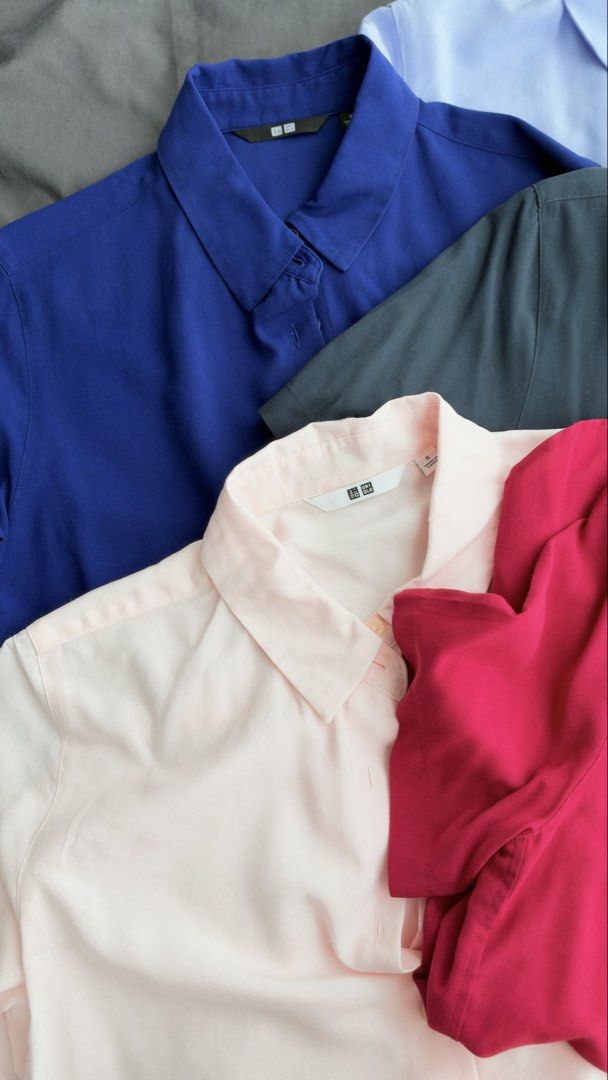 Uniqlo Rayon Blouse Short Sleeve (Category: Blouses) located in Taguig. Submitted by peanutbutterlove (Listing ID 1471360228, Image 2). Description: - Brand: Uniqlo - Size: Small (S) - Colors: Royal blue, light blue, dark grey, light pink, magenta pink - Design: Classic button-down collar with short sleeves - Fabric: Smooth, lightweight, and drapes nicely - Condition: Clean and well-kept Store SRP: P1,290 ‼️ buy all 5 for only P1,500 ⚠️ Price if 