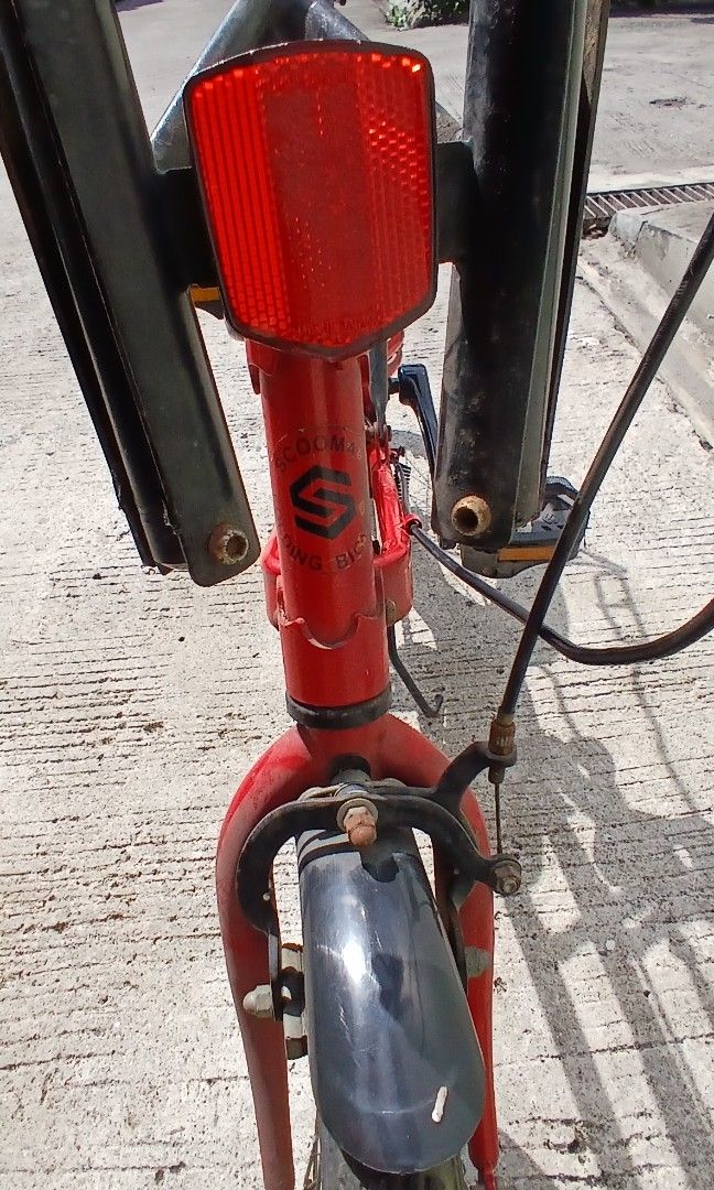Vintage scooma folding bike (Category: Bicycles) located in Marikina City. Submitted by darthvader888 (Listing ID 1471155139, Image 3). Description: - Brand: Field Champ folding bicycle - Color: Striking Red and Black - Features: Compact small-wheel design, convenient rear rack, and sturdy kickstand - Portability: Handlebars fold down easily for compact storage and transport - Mechanical: Chain and gears are intact and fully functional.
