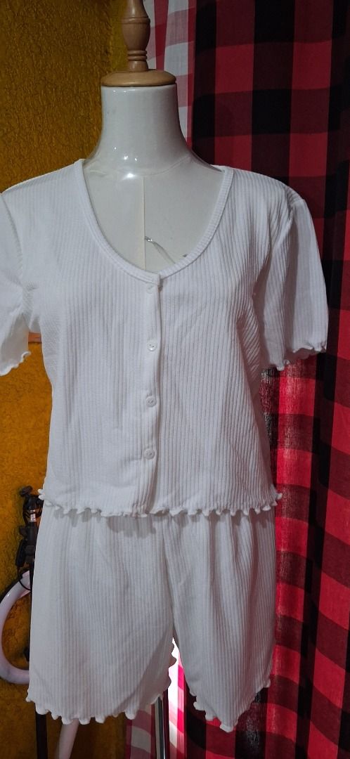 White Knit Short Sleeve Top and Shorts Set (Category: Sets or Coordinates) located in Manila. Submitted by katkween23 (Listing ID 1471339430, Image 3). Description: - Color: White - Material: Soft knit fabric - Set includes: Short sleeve top with button closure and lettuce hem + matching shorts with elastic waistband - Perfect for: Sleeping or lounging at home - Care: Easy to wash and maintain - Sizing: Standard sizing.