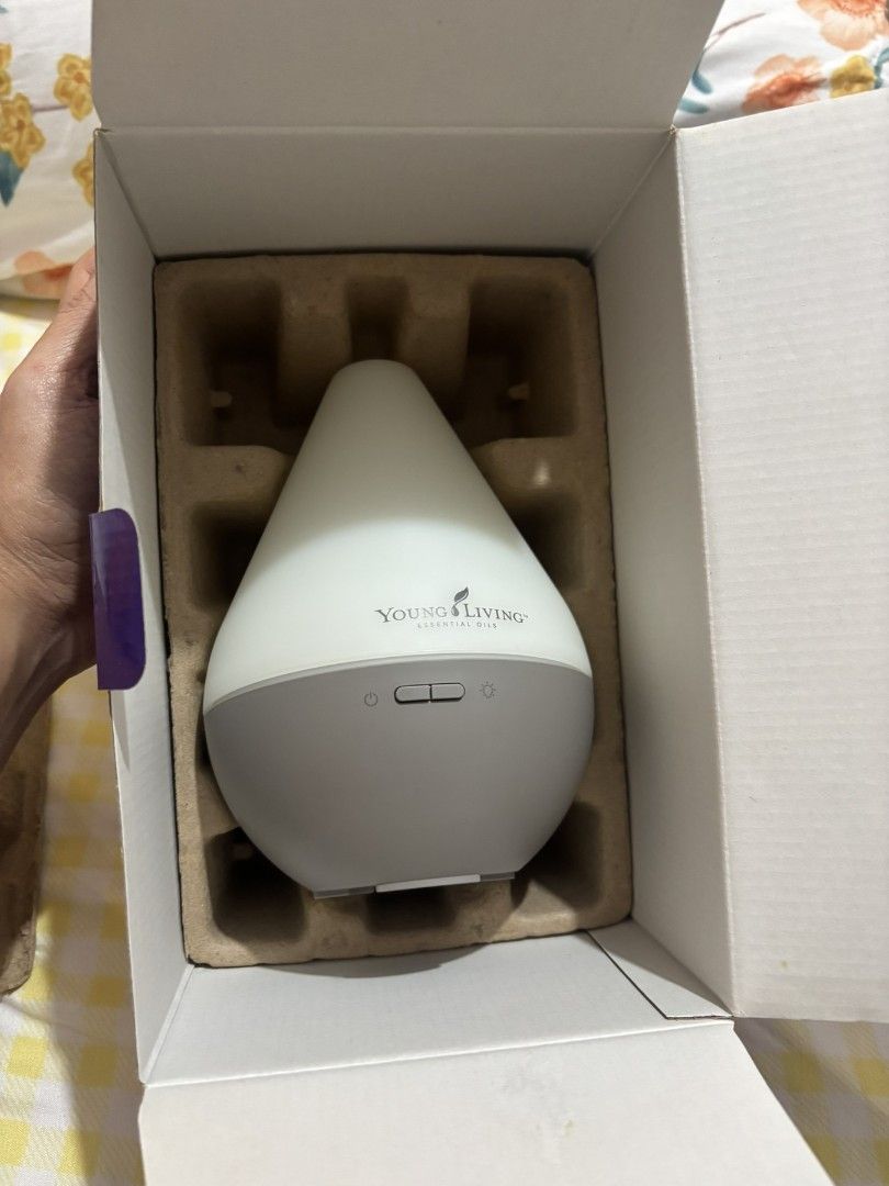 Young Living Dewdrop Essential Oil Ultrasonic Diffuser (Category: Home Fragrance) located in Quezon City. Submitted by gotchia2020 (Listing ID 1471300602, Image 2). Description: - Authentic Young Living Dewdrop ultrasonic essential oil diffuser - Includes original box and operation manual - Comes with a bonus 5ml Spearmint essential oil bottle - Simple and easy-to-use front button controls - Securely packed in molded cardboard packaging - Ideal f