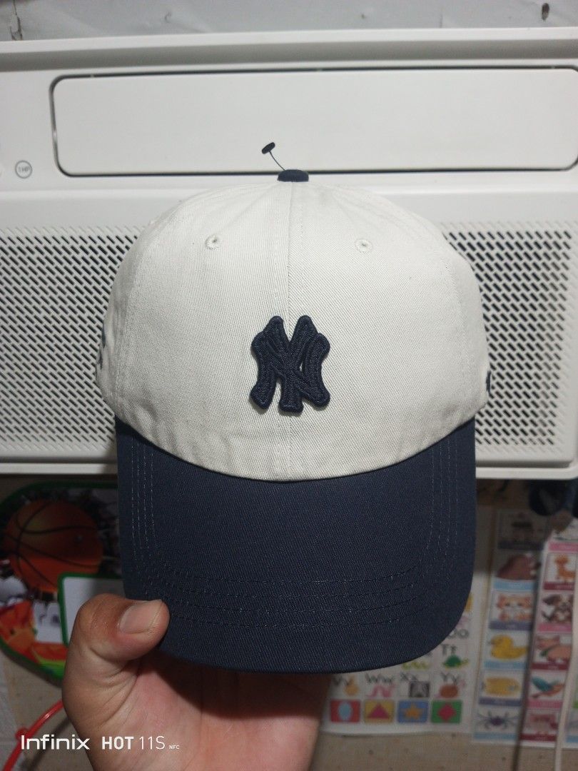 '47 New York Yankees MLB Baseball Cap Hat (Category: Caps & Hats) located in Las Pinas. Submitted by rzzr_thrift25 (Listing ID 1465781002, Image 1). Description: - Brand: '47 Brand - Team: New York Yankees (American League - The Bronx, New York) - Condition: Brand new, unworn with original retail tag ($38.00) and brim sticker attached - Colorway: Two-tone (Off-white crown / Navy blue curved brim) - Details: Embroidered front NY logo, side letteri