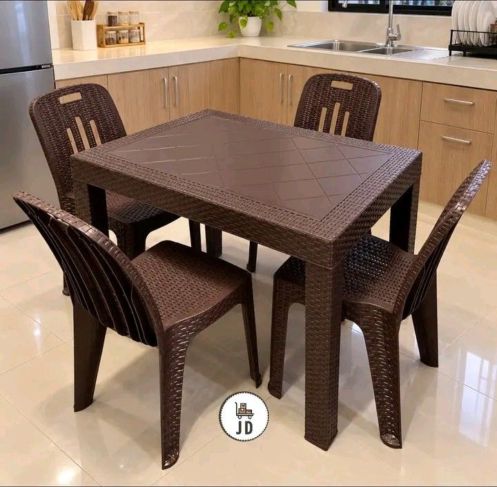 4 Seaters Rattan Dining Set Table size 24x28 (Category: Tables & Sets) located in Manila. Submitted by berdenmarl01688 (Listing ID 1465820176, Image 2). Description: - Complete dining set: 1 rectangular table and 4 matching chairs - Stylish dark brown with an intricate woven rattan texture on seats, backs, and table surface - Crafted from durable, weather-resistant plastic that is super easy to wipe clean - Built with sturdy legs on both the tabl