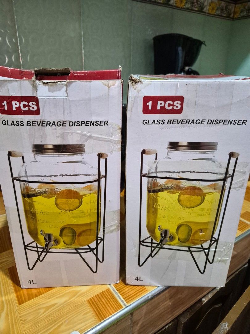 4L Glass Beverage Dispenser with Stand (Category: Pitchers & Dispensers) located in Antipolo. Submitted by prinsesa_dianne (Listing ID 1465940445, Image 1). Description: - Capacity: 4 litres each (2 units available) - Complete set includes: Glass dispenser, metal stand, spigot, and lid - Ideal for parties, gatherings, lemonade, and infused water - Condition: Brand new and untouched inside; outer boxes have minor storage wear - Flexible purchase: 