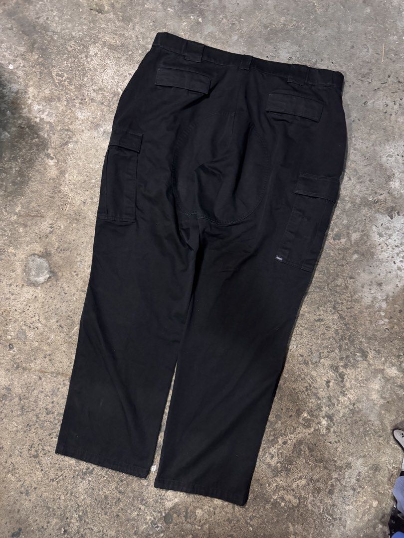 5.11 Tactical Black Cargo Pants Size 40 (Category: Trousers) located in Pasig City. Submitted by dripthrift1600 (Listing ID 1465949782, Image 2). Description: - Brand: 5.11 Tactical - Color: Black - Size: 40 - Material: Durable, heavy-duty fabric with reinforced knee and seat panels - Storage: Multiple utility pockets on the sides and back - Best for: Outdoor work, hiking, camping, and tactical training - Condition: Great quality utility wear - D
