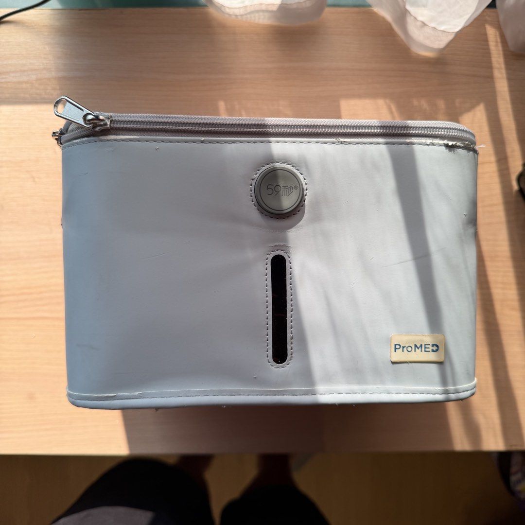 59S UVC LED Sterilization Bag ProMED (Category: Medical Supplies & Tools) located in Makati City. Submitted by hojichaboi (Listing ID 1465801716, Image 1). Description: - Authentic 59S x ProMED collaboration UV sterilization bag in stylish light grey - Portable zipper pouch design featuring a convenient top handle for easy travel - Advanced UVC LED technology for quick and effective sanitization - Simple one-touch operation via the front control 
