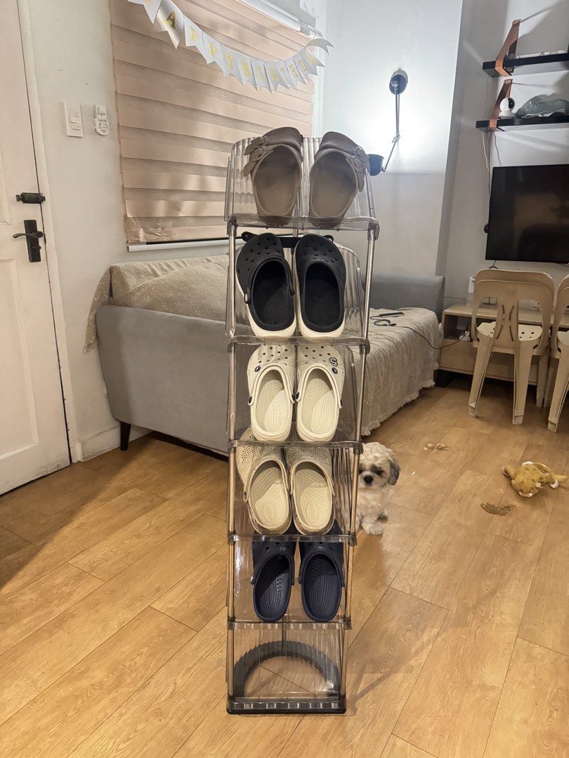 6 Layers Transparent Gray Space-saving Shoe Organizer (Category: Storage Boxes & Baskets) located in Taguig. Submitted by preloved_sars (Listing ID 1465931431, Image 2). Description: - 6-tier vertical shoe rack to maximize your space - Stylish transparent gray plastic shelves with sturdy stainless steel posts - Stands approx. 120cm tall, holds multiple pairs of footwear - Quick and easy assembly with snap-in parts - Perfect for keeping your entry