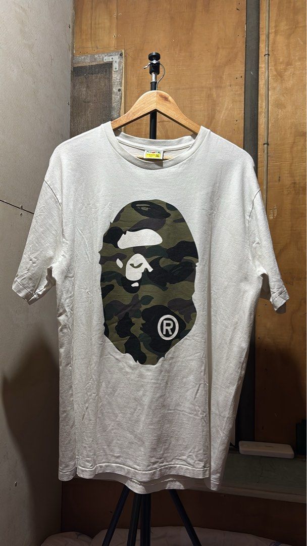 A Bathing Ape Bape Camo Ape Head Tee 2XL (Category: Tshirts & Polo Shirts ) located in Manila. Submitted by kobthrift.1223 (Listing ID 1465912166, Image 1). Description: - Brand: A Bathing Ape (Bape) bape mirror color rate 9/10 30x23 2200 negotiable .