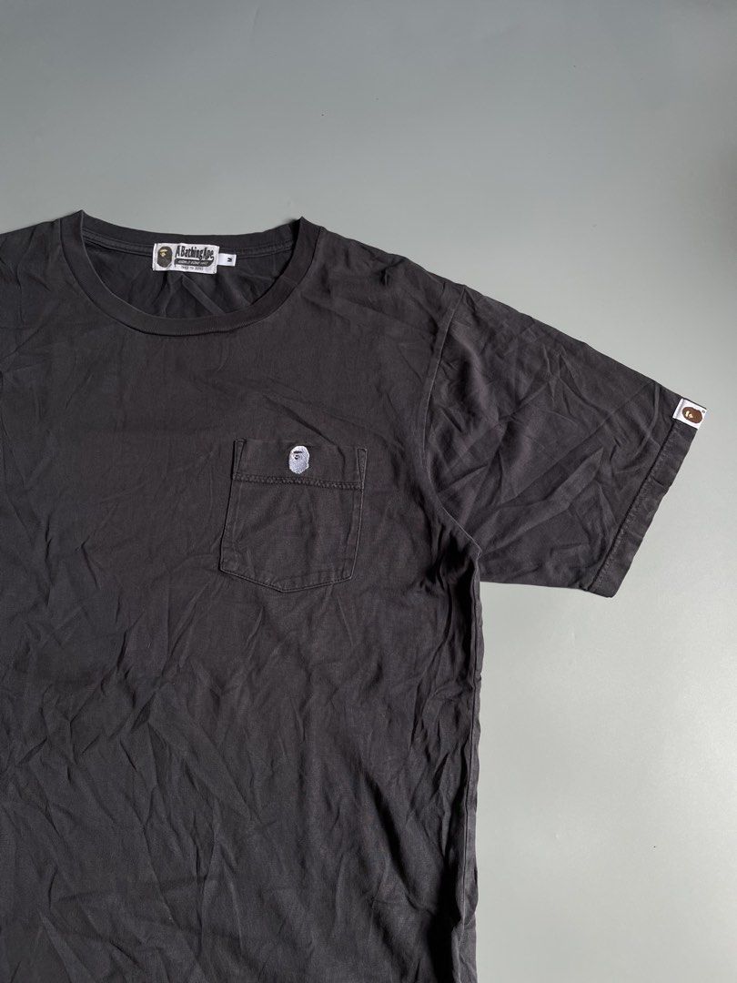 A Bathing Ape One Point Pocket Tee (Category: Activewear) located in Taguig. Submitted by _curatedfits (Listing ID 1465870702, Image 2). Description: A Bathing Ape One Point Pocket Tee Size: Medium Width 20 Length 28 Gray No flaws Discoloration look is due only to lightings - 950 Dm! .