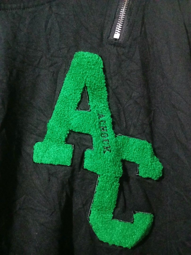 A CHOCK Dark Grey Sweater with Green Letters (Category: Coats, Jackets and Outerwear) located in Caloocan City. Submitted by vincefresn21903 (Listing ID 1465840444, Image 2). Description: - Brand: A CHOCK - Color: Dark grey - Size: M - Material: 100% cotton (comfortable for daily wear) - Design: Crew neck with bright green fuzzy letter patch on chest - Extra detail: Decorative zipper near the right shoulder - Condition: Excellent / Ready to wear.
