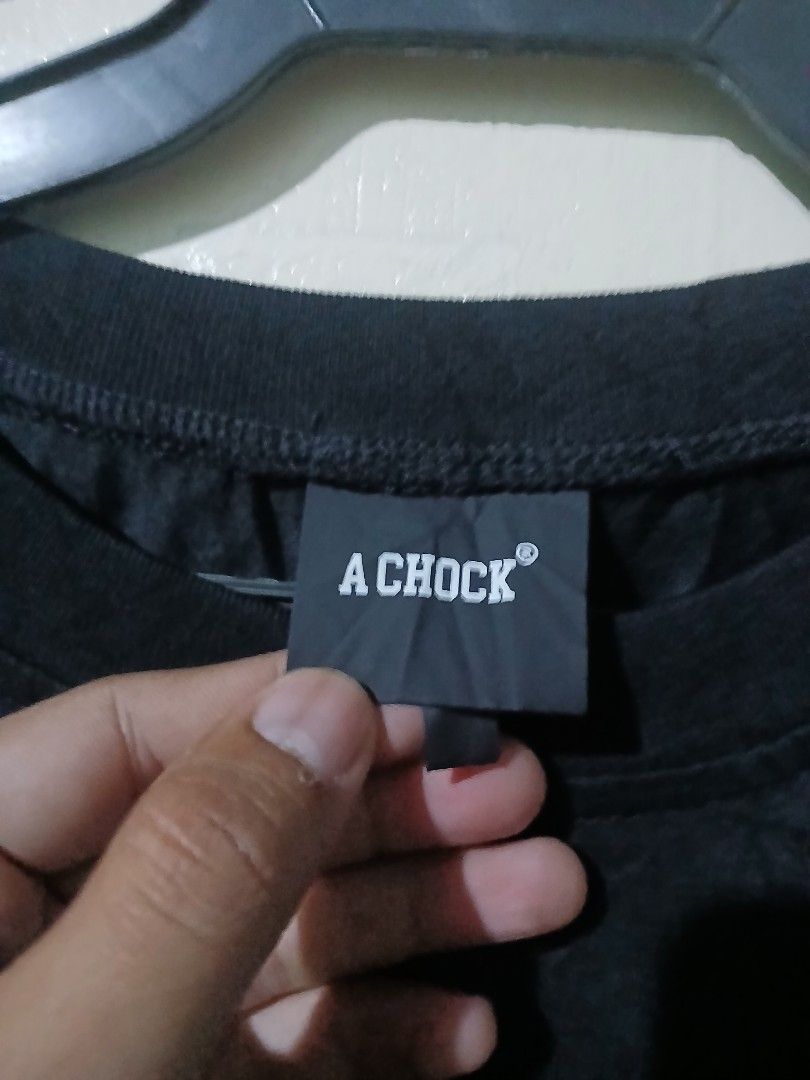 A CHOCK Dark Grey Sweater with Green Letters (Category: Coats, Jackets and Outerwear) located in Caloocan City. Submitted by vincefresn21903 (Listing ID 1465840444, Image 3). Description: - Brand: A CHOCK - Color: Dark grey - Size: M - Material: 100% cotton (comfortable for daily wear) - Design: Crew neck with bright green fuzzy letter patch on chest - Extra detail: Decorative zipper near the right shoulder - Condition: Excellent / Ready to wear.
