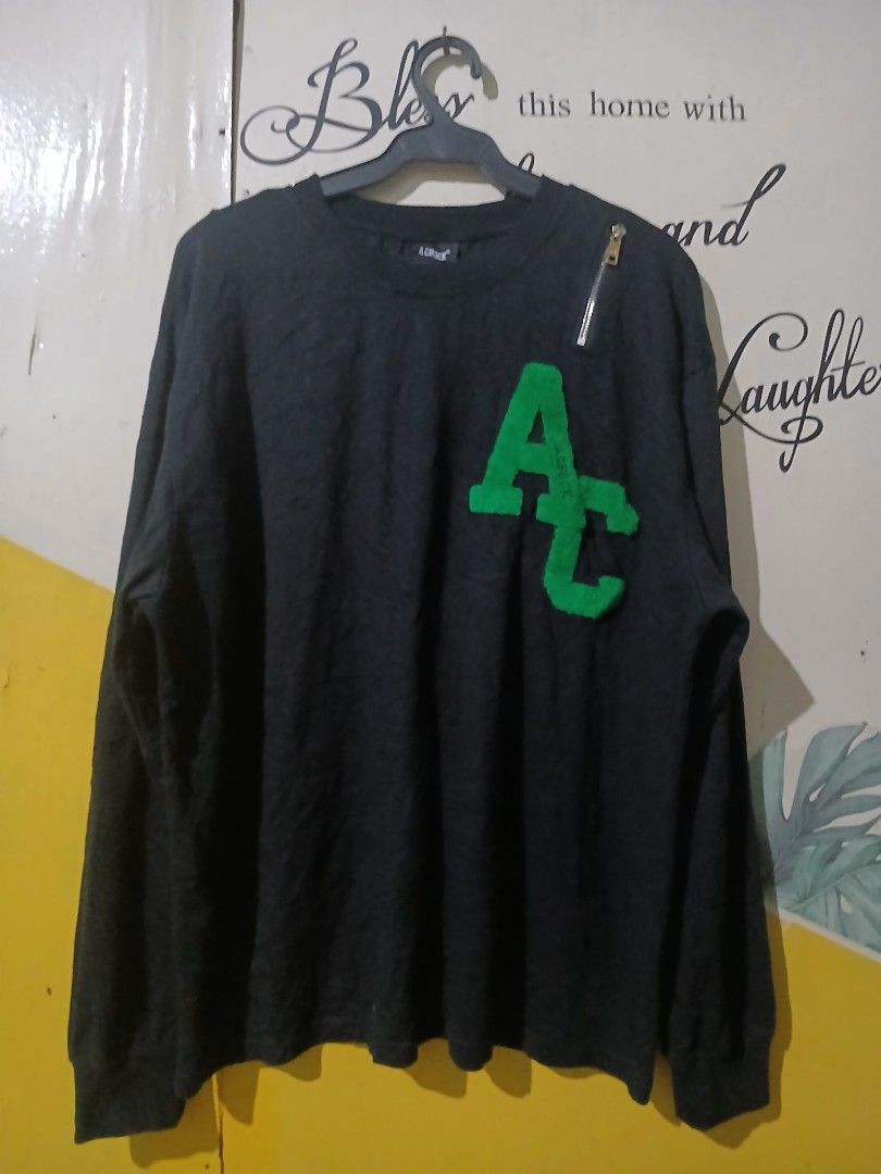 A CHOCK Dark Grey Sweater with Green Letters (Category: Coats, Jackets and Outerwear) located in Caloocan City. Submitted by vincefresn21903 (Listing ID 1465840444, Image 1). Description: - Brand: A CHOCK - Color: Dark grey - Size: M - Material: 100% cotton (comfortable for daily wear) - Design: Crew neck with bright green fuzzy letter patch on chest - Extra detail: Decorative zipper near the right shoulder - Condition: Excellent / Ready to wear.