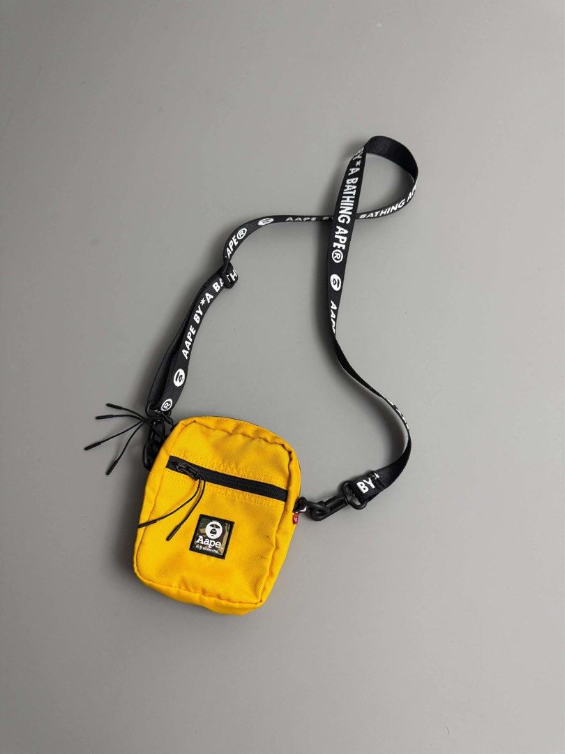 AAPE BY A BATHING APE (Category: Cross-body Bags) located in Guagua. Submitted by sweetboyy (Listing ID 1465768953, Image 2). Description: AAPE BY A BATHING APE YELLOW CROSSBODY SHOULDER POUCH.