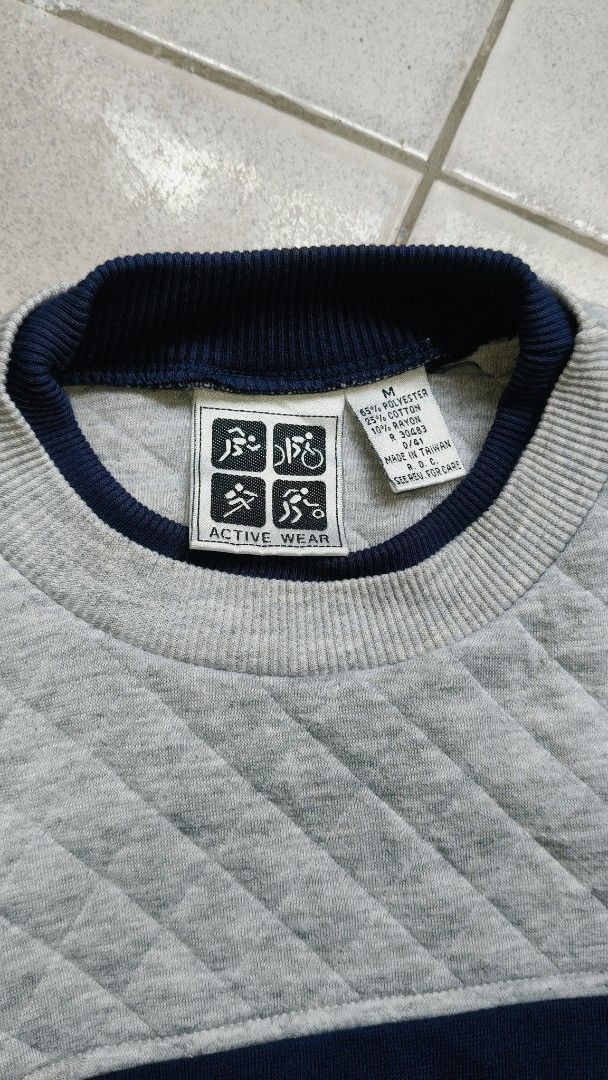 Active Wear Quilted Colorblock Sweatshirt Medium (Category: Coats, Jackets and Outerwear) located in Manila. Submitted by moneyroll420 (Listing ID 1465861523, Image 2). Description: - Brand: Activewear - Size: M - Design: Grey, navy, and striped colorblock with quilted upper chest texture - Style: Crew neck with ribbed cuffs and hem - Material: 65% polyester, 25% cotton, 10% rayon - Origin: Made in Taiwan - Condition: Excellent / Ready to wear.