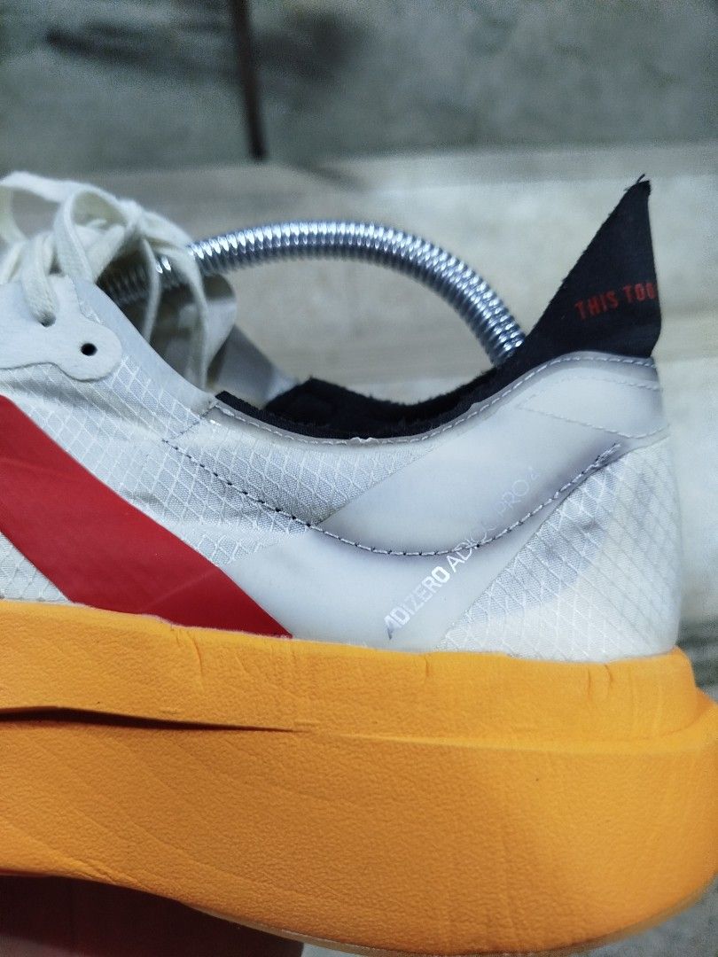Adidas Adizero Adios Pro 4 (Category: Sneakers) located in Aroroy. Submitted by dr0p-a-dr1p (Listing ID 1465912161, Image 3). Description: THIS IS THRIFTED WITHOUT BOX SIZE 8.5 - Brand/Model: Adidas Adizero Adios Pro 4 - Colorway: White upper with bold red stripes and striking orange Lightstrike Pro midsole - Size: US 8.5 / UK 8 / FR 42 - Condition: Clean soles, minimal signs of wear - Ideal For: Marathon training and race day speed - Details: In