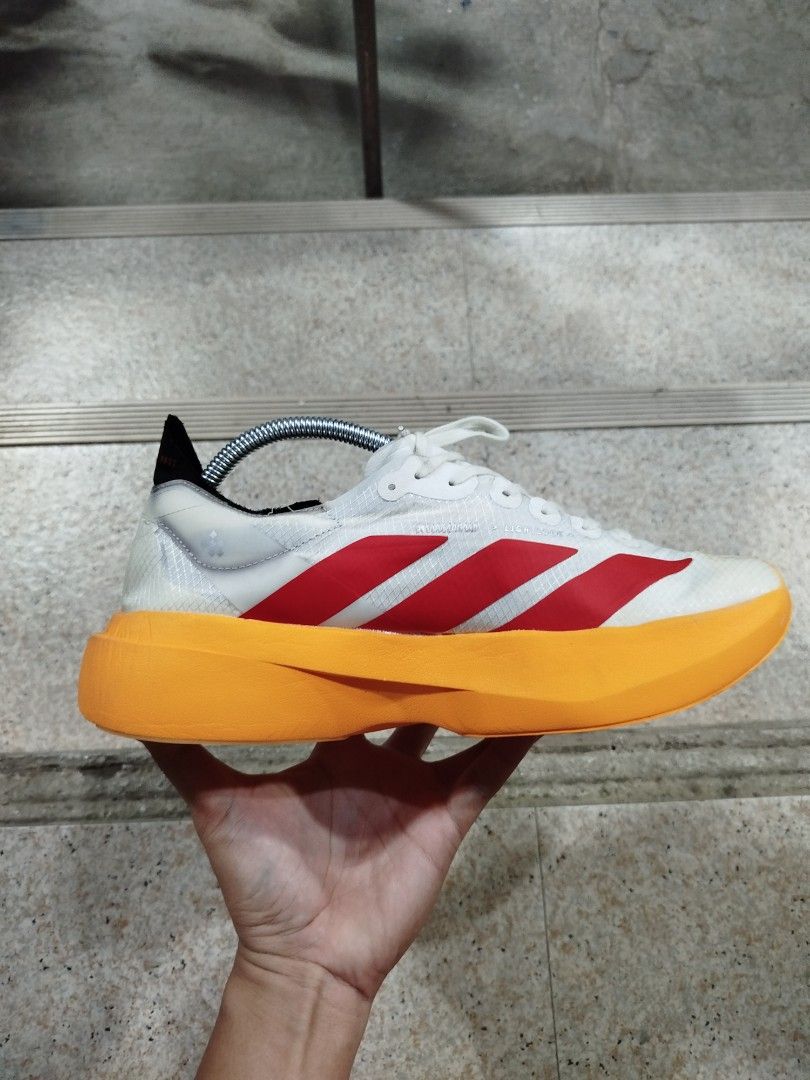 Adidas Adizero Adios Pro 4 (Category: Sneakers) located in Aroroy. Submitted by dr0p-a-dr1p (Listing ID 1465912161, Image 1). Description: THIS IS THRIFTED WITHOUT BOX SIZE 8.5 - Brand/Model: Adidas Adizero Adios Pro 4 - Colorway: White upper with bold red stripes and striking orange Lightstrike Pro midsole - Size: US 8.5 / UK 8 / FR 42 - Condition: Clean soles, minimal signs of wear - Ideal For: Marathon training and race day speed - Details: In