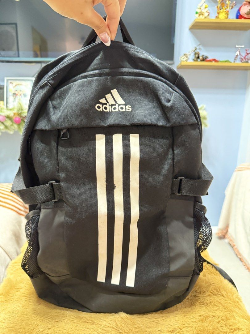 Adidas Black Backpack with 3 White Stripes (Category: Backpacks) located in Alaminos. Submitted by jhean1323 (Listing ID 1465820723, Image 1). Description: - Authentic black Adidas backpack - Bold white stripes and classic logo on the front - Dual zipper main compartment with black lining and interior Adidas tag - Mesh side pockets for water bottles - Padded mesh shoulder straps and back panel for all-day comfort - Adjustable side compression str