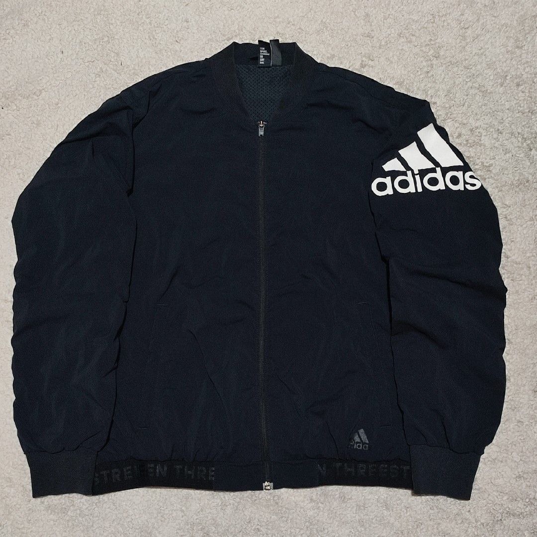 Adidas Black Bomber Jacket with Large Shoulder Logo (Category: Coats, Jackets and Outerwear) located in Manila. Submitted by anthonig (Listing ID 1465872885, Image 1). Description: Color may vary due to lighting Length: 26 inches Width: 22.5 inches Price: 400 pesos Condition: 9.2/10 Issues: last 2 photos PM if interested or for inquiries Meetups within MANILA only Can do shipping at buyers expense.