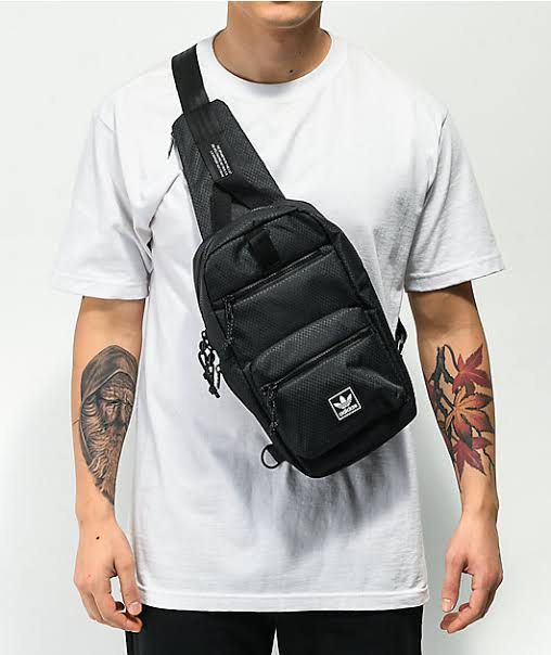 Adidas black crossbody sling bag (Category: Sling Bags) located in Manila. Submitted by s_czch (Listing ID 1465902769, Image 3). Description: - Brand new with original tag attached - Durable black textured ripstop material - Secure main zip compartment and extra front zip pocket - Iconic white Adidas trefoil logo patch - Adjustable black strap with convenient clip attachment ‼️Price is negotiable 📍Meetup around SM North Edsa or UST.