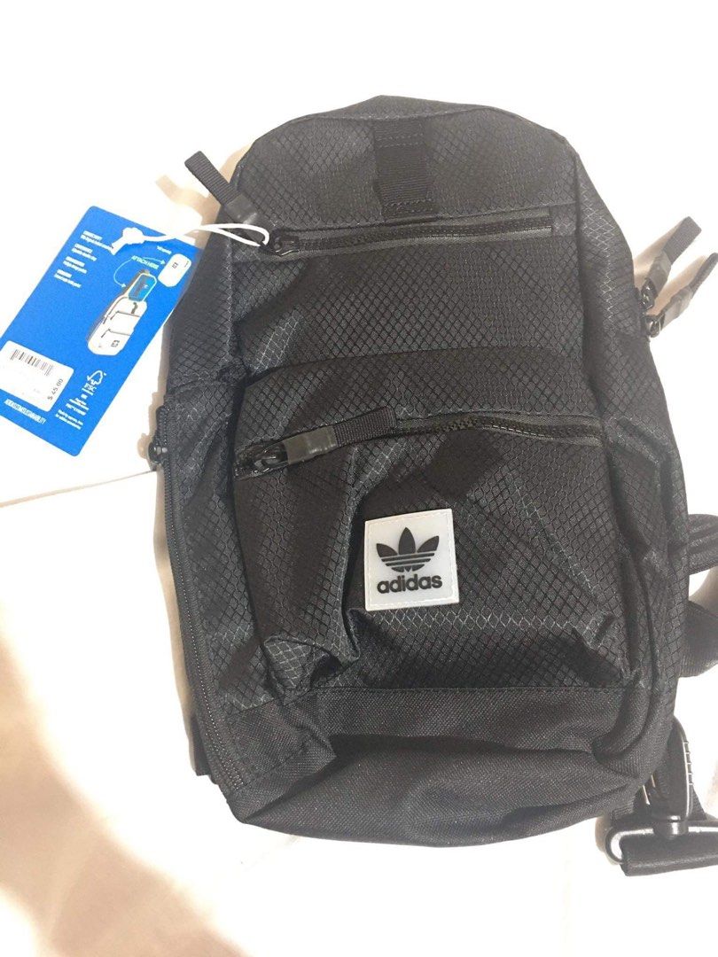 Adidas black crossbody sling bag (Category: Sling Bags) located in Manila. Submitted by s_czch (Listing ID 1465902769, Image 1). Description: - Brand new with original tag attached - Durable black textured ripstop material - Secure main zip compartment and extra front zip pocket - Iconic white Adidas trefoil logo patch - Adjustable black strap with convenient clip attachment ‼️Price is negotiable 📍Meetup around SM North Edsa or UST.