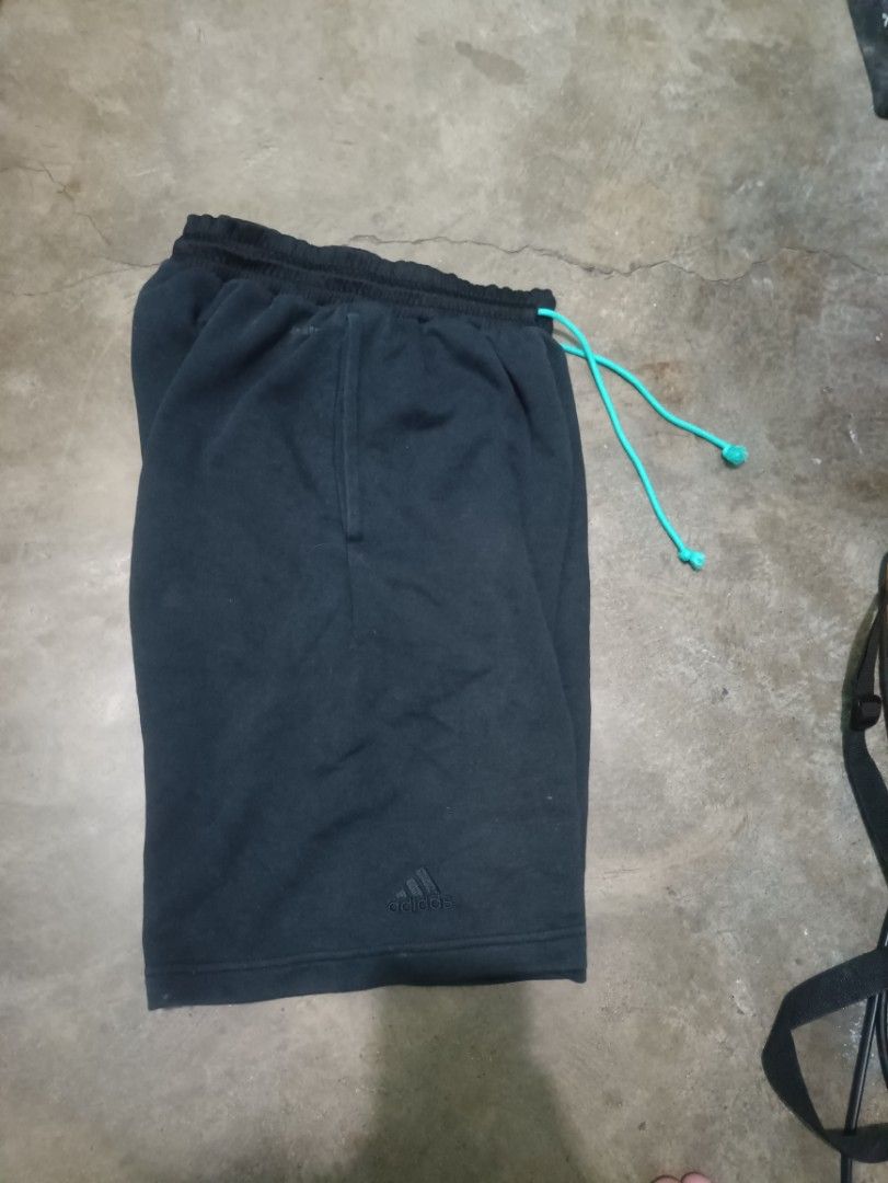 Adidas black Shorts with Teal Drawstring and Logo (Category: Shorts) located in Quezon City. Submitted by kramps.23 (Listing ID 1465897459, Image 3). Description: - Brand: Adidas - Size: Medium (Made in Vietnam) - Color: Black with bold white leg logo and subtle embroidered logo near hem - Features: Bright teal adjustable drawstring, purple inner waistband lining, and 2 convenient side pockets Dimes: - Waist: 29 and up - Lenght: 21 - LO: 12 Issue