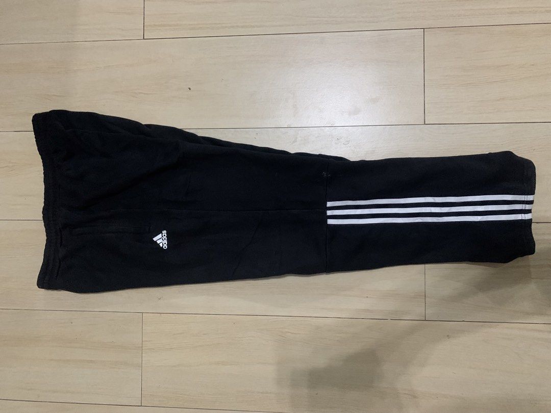 Adidas Black Sweatpants DM7311 Size L (Category: Joggers) located in Manila. Submitted by thrifty111 (Listing ID 1465924880, Image 2). Description: - Brand: Adidas - Color: Black with white three stripes near the cuffs - Size: Large (180/86A on tag) - Style Code: DM7311 - Features: Adjustable drawstring waistband and functional side pockets - Origin: Made in China - Condition: Classic athletic fit, perfect for daily wear or workouts - Trusted Car