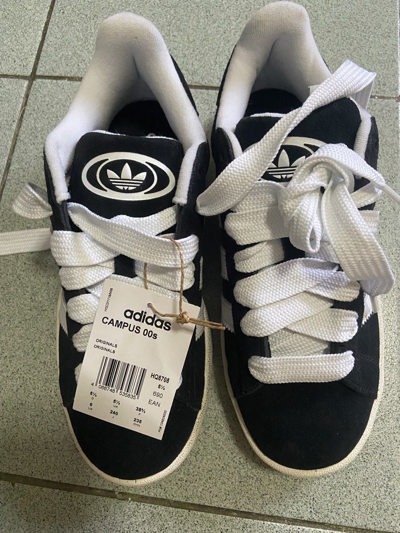 Adidas Campus 00s Black White (Category: Sneakers) located in Silang. Submitted by Apple_Mac07 (Listing ID 1465827213, Image 2). Description: - Model: Adidas Campus 00s (Core Black / Footwear White) - Size: US 6 / UK 5.5 / EUR 38 2/3 - Condition: Brand new with tags attached - Includes: Original blue shoebox and chunky white laces (plus 1 pair of black shoelaces) - Material: Premium suede upper with durable gum rubber outsole - Design: Thick padd