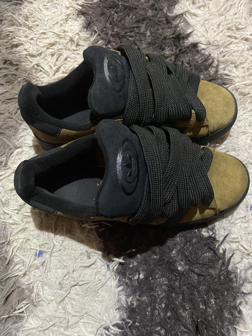 Adidas Campus 00s Olive Brown Black (Category: Sneakers) located in Manila. Submitted by coollion.19b40f (Listing ID 1465932601, Image 3). Description: - Brand: Adidas - Model: Campus 00s - Colorway: Olive Green / Black - Details: Premium suede upper, chunky black laces, padded tongue, and signature three stripes - Condition: Clean soles, crisp suede texture, ready to wear - Style: Low-top skate shoe.