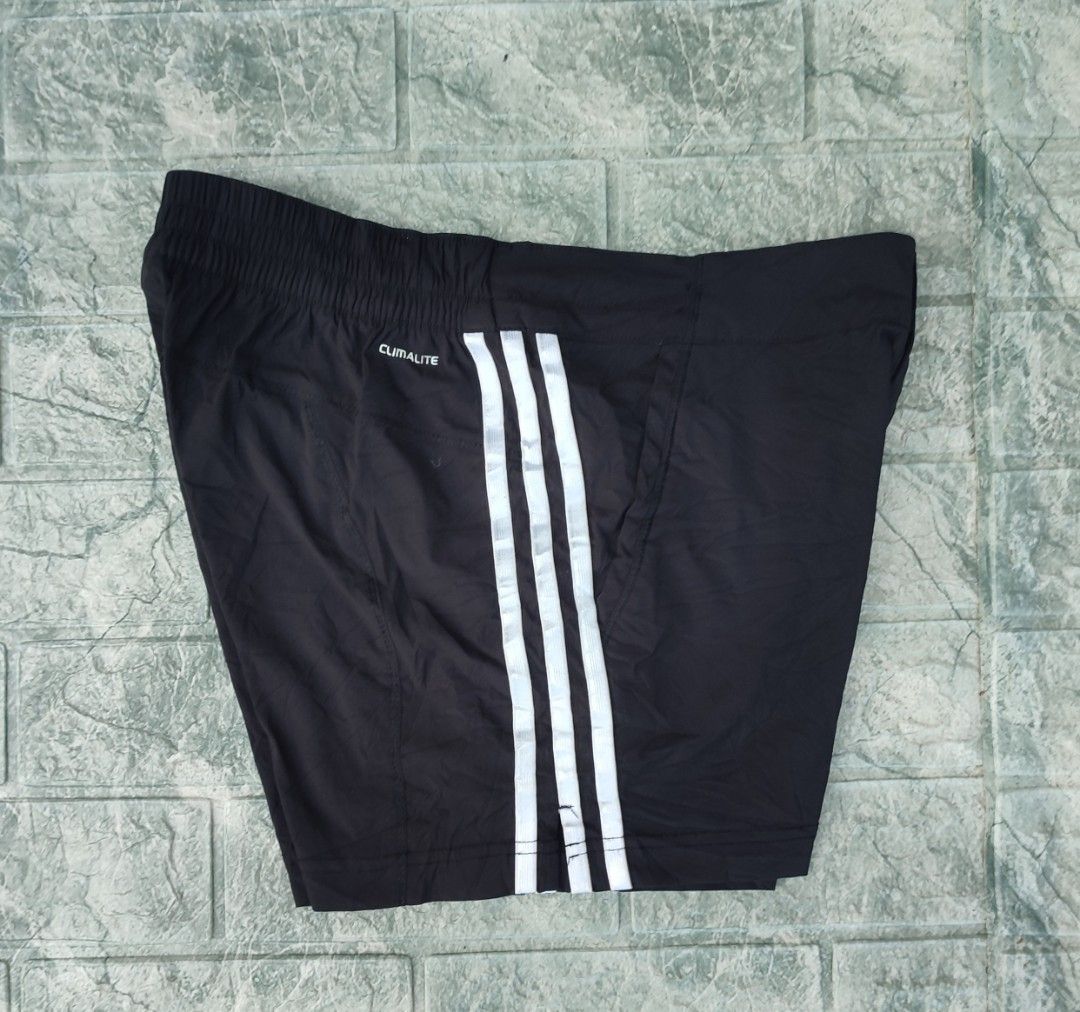 Adidas Climalite Black Athletic Shorts (Category: Shorts) located in Bayambang. Submitted by mon10192816 (Listing ID 1465874601, Image 2). Description: - Waist 31-34 - Lenght 13 - Issue Loose Stitch check last photo - Brand: Adidas - Style: Athletic shorts with iconic white 3-stripe design - Technology: Climalite fabric keeps you dry and cool during workouts - Features: Elastic waistband with front snap button closure and convenient side pockets 