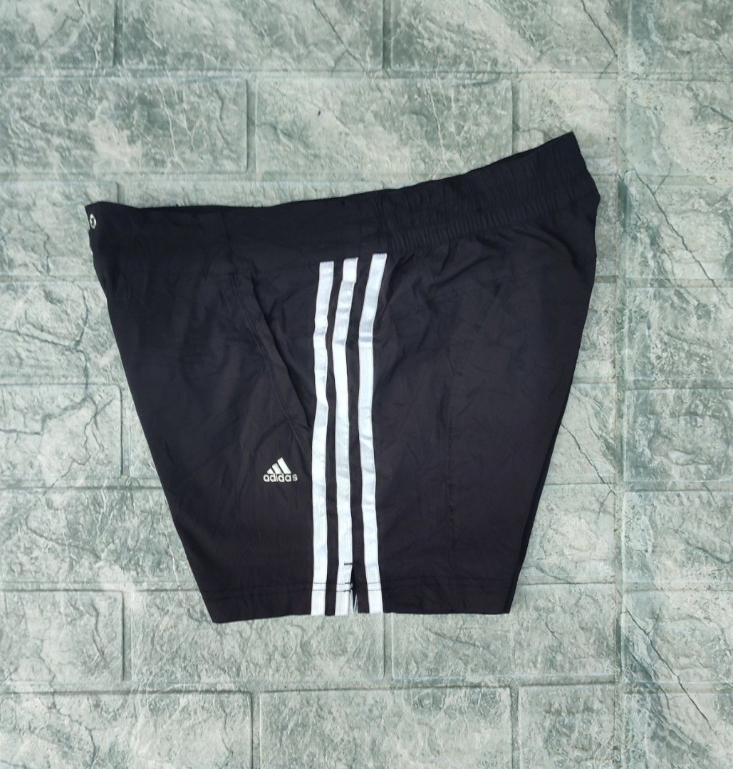 Adidas Climalite Black Athletic Shorts (Category: Shorts) located in Bayambang. Submitted by mon10192816 (Listing ID 1465874601, Image 1). Description: - Waist 31-34 - Lenght 13 - Issue Loose Stitch check last photo - Brand: Adidas - Style: Athletic shorts with iconic white 3-stripe design - Technology: Climalite fabric keeps you dry and cool during workouts - Features: Elastic waistband with front snap button closure and convenient side pockets 