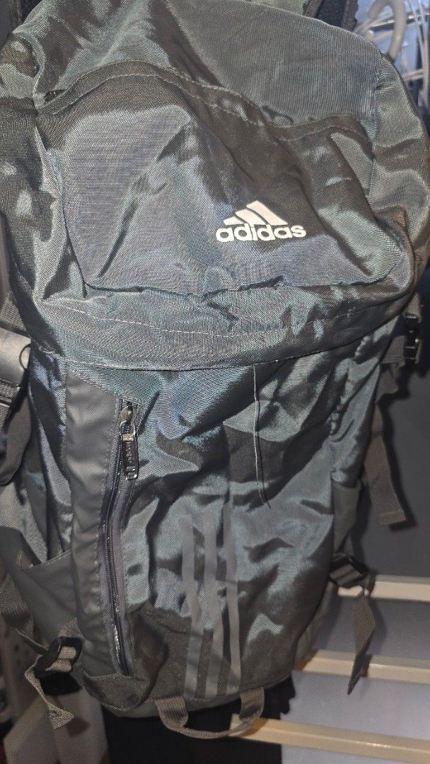 Adidas Grey 30L Backpack (Category: Backpacks) located in Caloocan City. Submitted by marces (Listing ID 1465823339, Image 3). Description: Adidas Grey Backpack (immitation) - Capacity: 30 Litres (Dimensions: 50cm H x 30cm W x 20cm D) - Design: Iconic three-stripe branding down the front - Storage: Secure zippered side pocket for easy access - Comfort: Adjustable straps with durable buckles - Versatility: Ideal for school, gym sessions, or short 