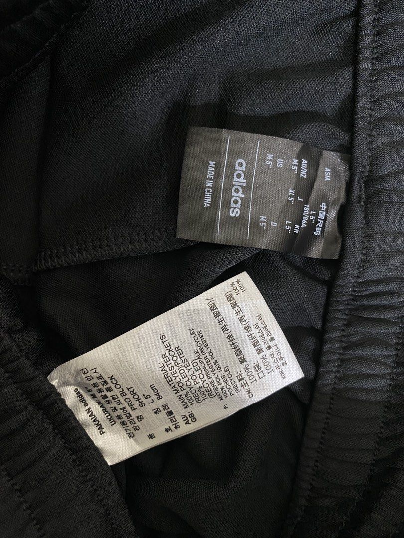 Adidas Pro Block Shorts Black Size M (Category: Shorts) located in Cebu City. Submitted by theloose.thread (Listing ID 1465919697, Image 2). Description: - Brand: Adidas Pro Block Shorts - Color: Black with white graphic contrast panel - Size: Medium (M) with 5-inch inseam - Material: 100% recycled polyester - Waistband: Elastic with internal drawstring - Condition: Brand new with tags attached - Ideal for workouts, sports, or casual streetwear.